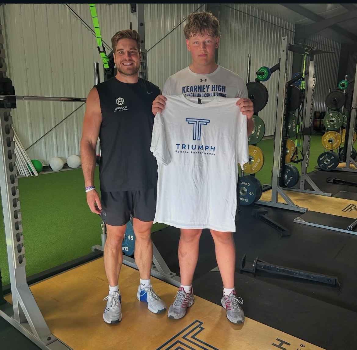 Triumph athlete receiving a training shirt