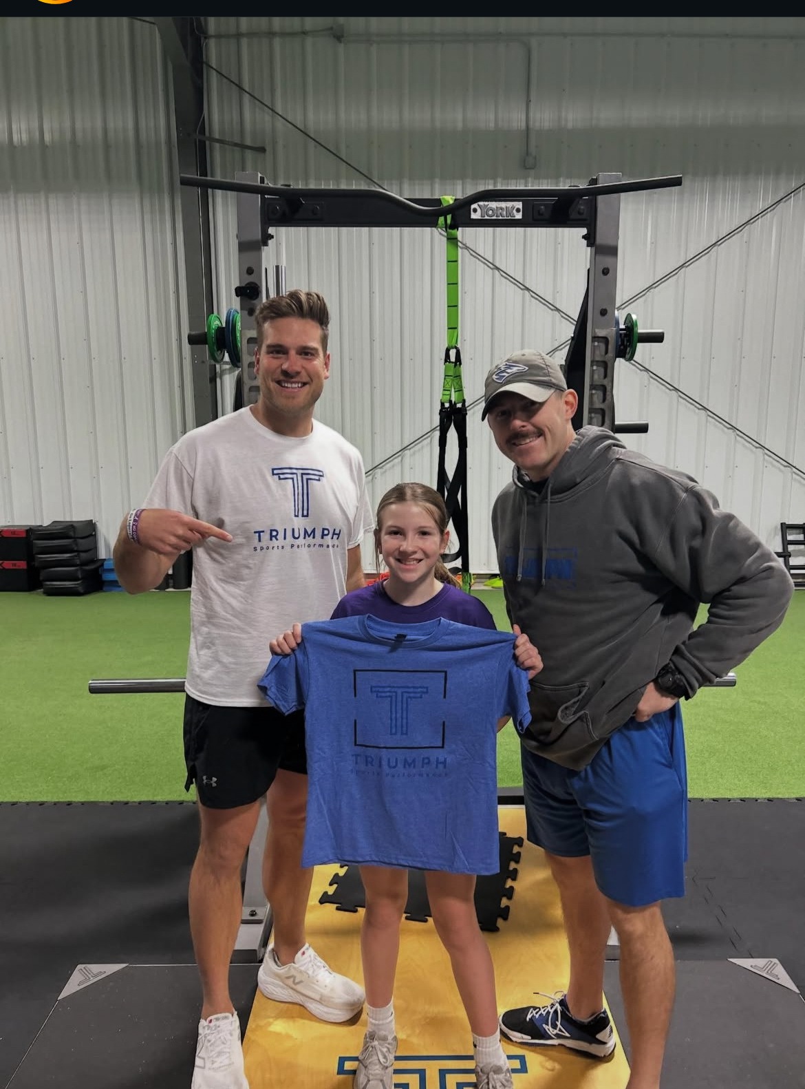 Young athlete and family celebrating at Triumph