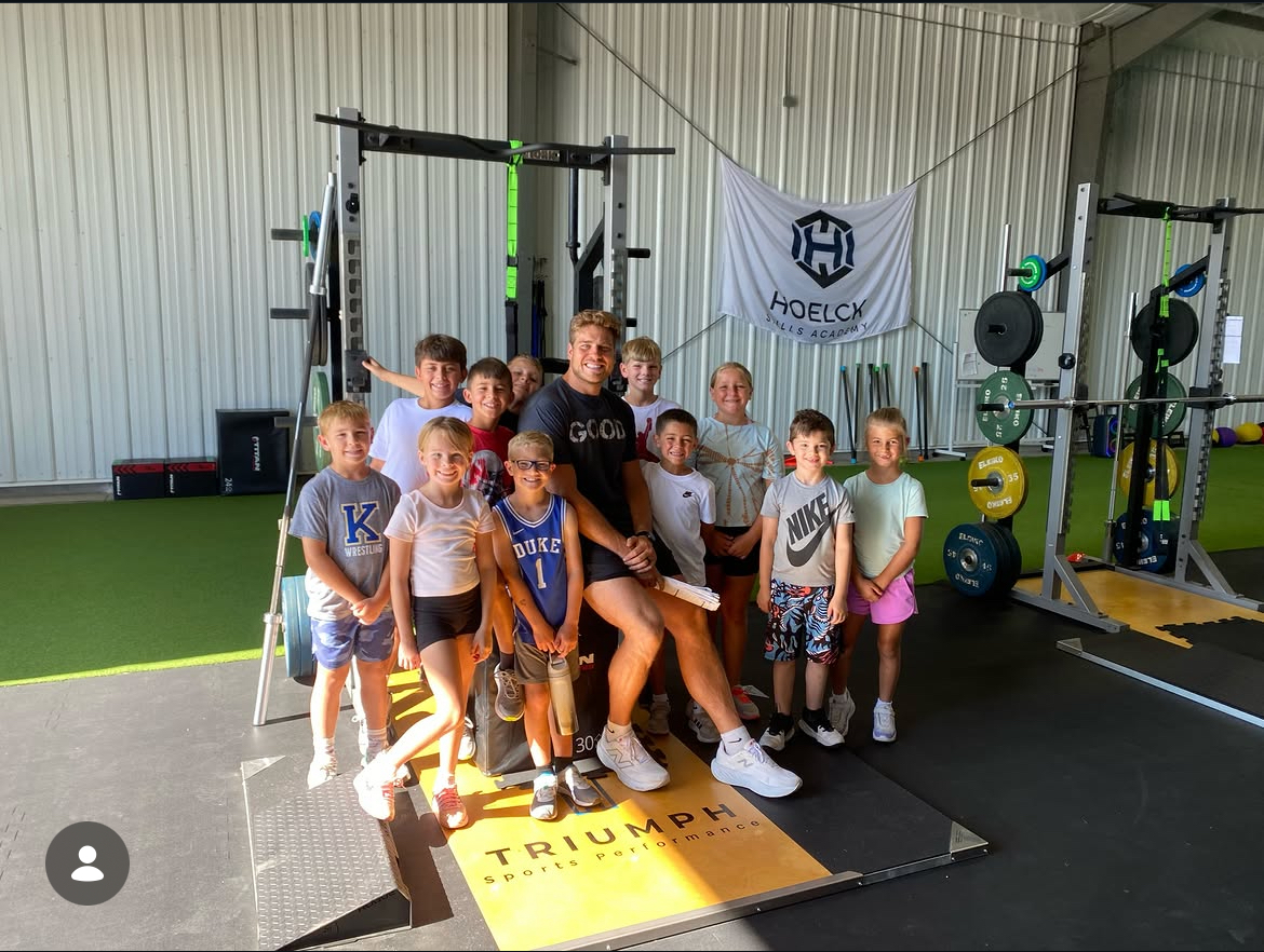 Triumph youth athletes and coaches after training
